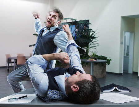 39184919 - two furious businessmen fighting in the office